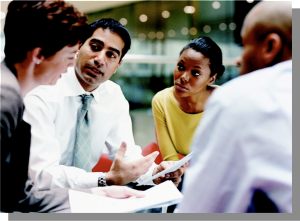 3 men and women working at table